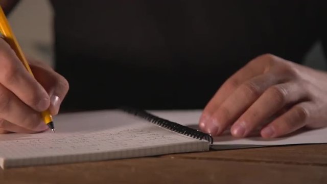 hand writing in notebook