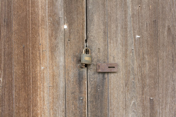 lock a door and Wood building surface and texture.
 lock on the door. lock on the door of an old farmhouse