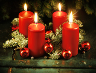 Xmas Advent wreath with four lighted candles
