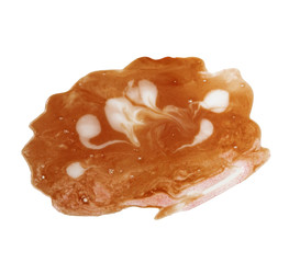 Abstract spotty brown blot on white background.