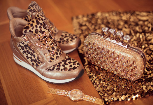 Fashion Leopard sneakers with Glamour golden wristwatch and purs