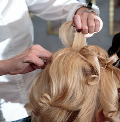 Fototapeta premium Barber makes laying blonde