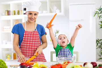 Happy family making vegetables vegetarian meal