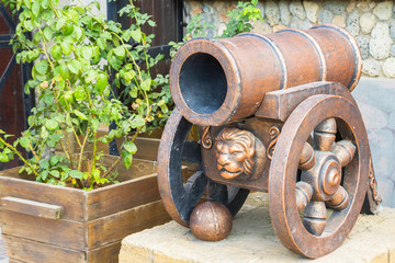 Gun with decorative ornament in the form of a lion