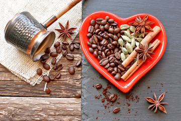 Heart plate with coffee grains  , cardamon, cinnamon, anise on stone and turk on sackcloth