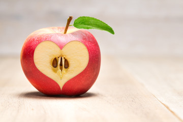 heart cutted out of red apple
