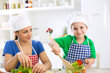 Mom and kid cooking together