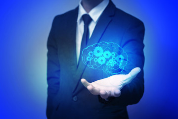 Close up of human hand holding brain