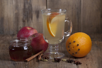 Spiced tea with fruits  and spices in a glass  .