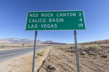 Gartenposter Las Vegas and Red Rock Canyon Sign with Bullet Holes © trekandphoto