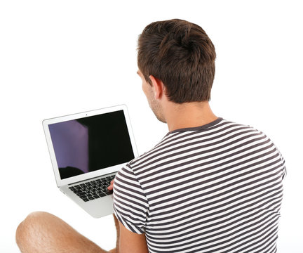 Man with laptop isolated on white, backside view