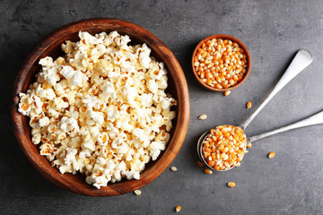 Popcorn and corn beans on dark background
