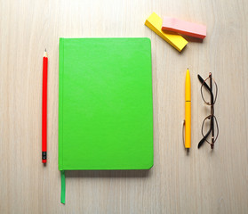 Colourful stationery on wooden background, close up