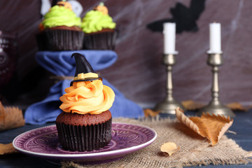 Halloween cupcake on plate on the table