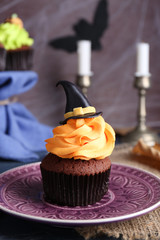 Halloween cupcake on plate on the table