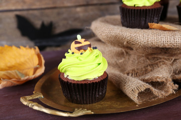 Halloween cupcakes on metal tray on the table
