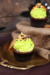 Halloween cupcakes on metal tray on the table