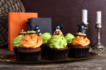 Halloween cupcakes on wooden table