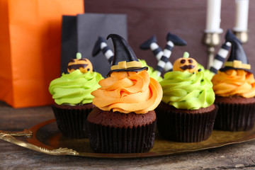 Halloween cupcakes on wooden table