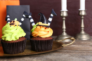 Halloween cupcakes on wooden table