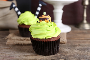 Halloween cupcakes on wooden table