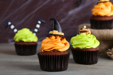 Halloween cupcakes and decoration on table