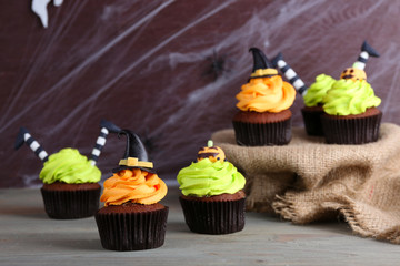 Halloween cupcakes and decoration on table