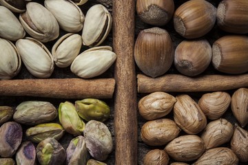 Composition with nuts, hazelnuts and pistachios close up