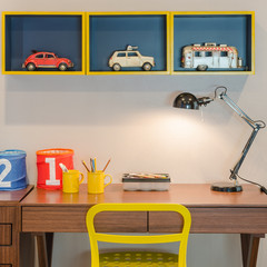 yellow chair and wooden desk with modern black lamp