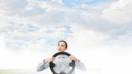 Woman with steering wheel