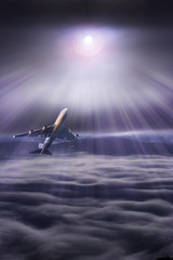 Airplane in the sky at sunset