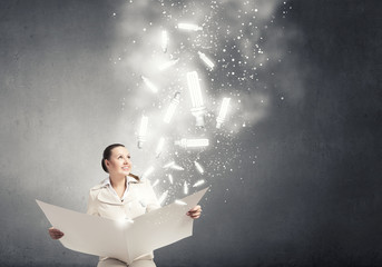 Woman reading newspaper
