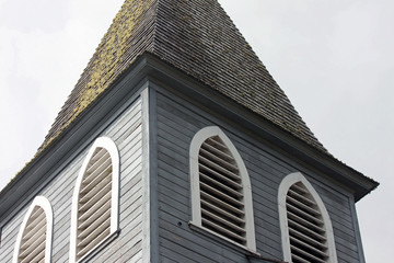 Closeup of Gray Wooden Church Steeple
