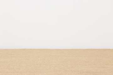 Empty table covered with hessian tablecloth
