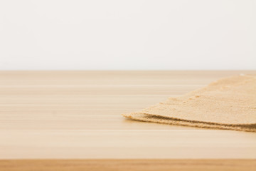 Empty table covered with hessian tablecloth