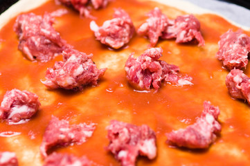 Homemade Pizza  preparation with Sauasage