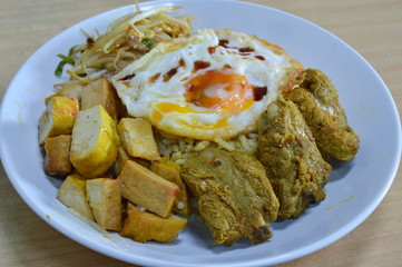 boiled curry pork rib and tofu topping fried egg topping on rice