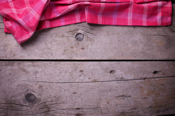 Kitchen towel  on vintage  wooden background.