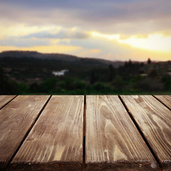 Fototapeta na wymiar Wooden board on beautiful sunset background