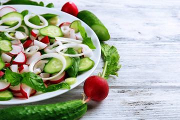 Fresh vegetable salad on table close up