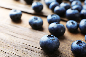 Fresh blueberries on wooden table, closeup