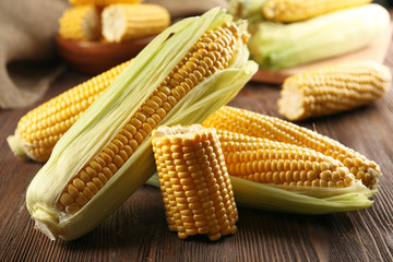 Ripe corn on wooden background