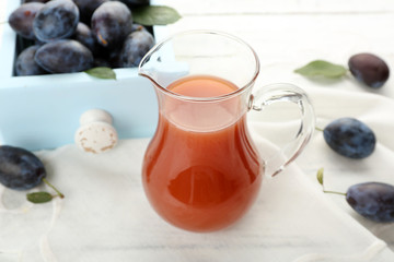 Plum Juice in a jar with fresh fruits
