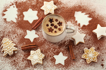 Beautiful composition with cup of cappuccino and Christmas cookies