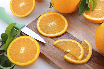 Slicing oranges.