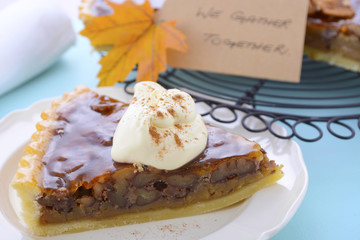 Traditional Thanksgiving Pecan Pie on Pale Blue Wood.
