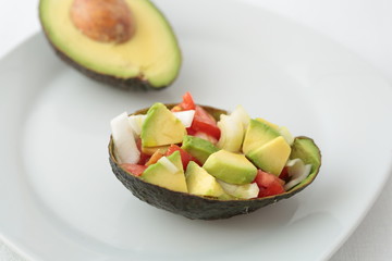 mixed salad on a natural bowl of avocado