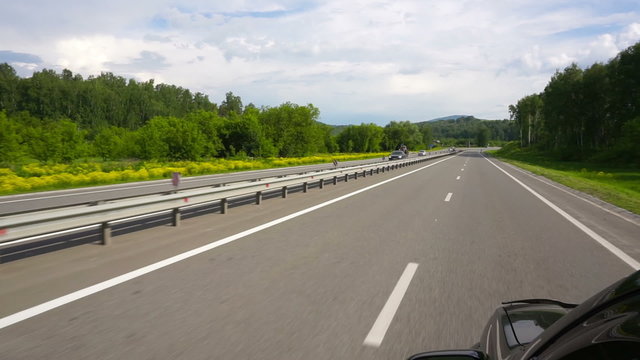 Driving on road in car
