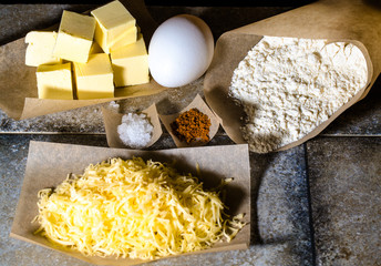 Ingredients for baking on pergament paper on grey stone table li