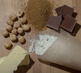 Ingredients for baking on light wooden table like background. Se